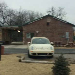 a car parked in front of a building