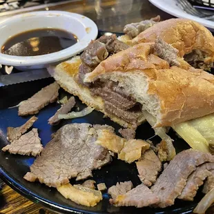 French dip cut in half, showing the streakums quality meat.