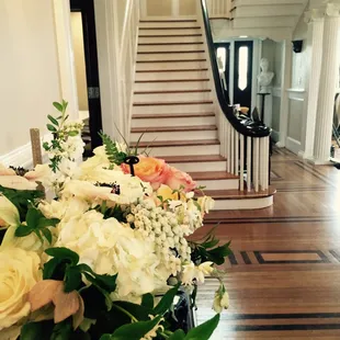 a vase of flowers in the foyer