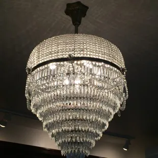 a crystal chandelier hanging from the ceiling