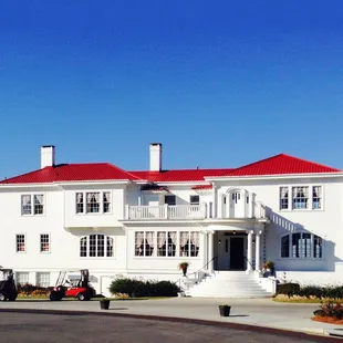 a white house with a red roof