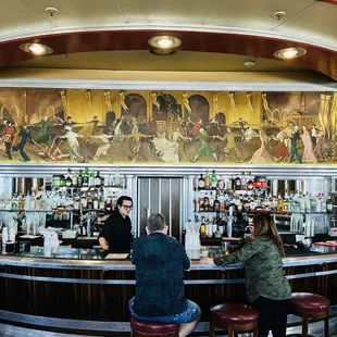 two people sitting at the bar