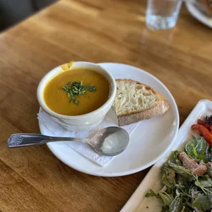a plate of food and a bowl of soup