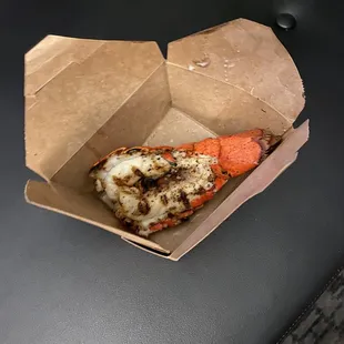 a crab and lobster in a box