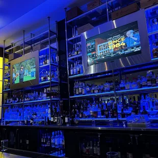 a bar with a lot of bottles