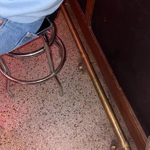 a person sitting on a stool