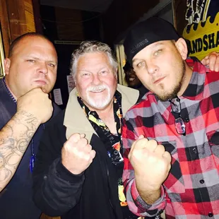 three men posing for a picture