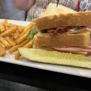 The Club Sandwich with fries.