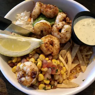 The bowls are really good! I added grilled shrimp to mine. Underneath is shredded cabbage, rice, beans, avocado.