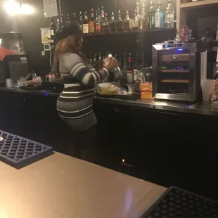 a woman behind the counter