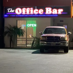 a truck parked in front of a building