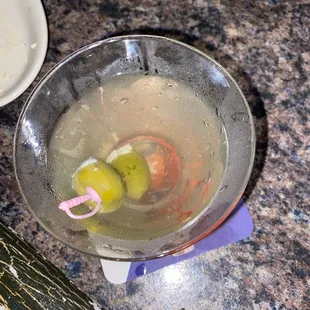 a martini with olives in it