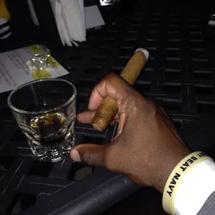 Chilling with a rum and a Montecristo smoke on the back patio.