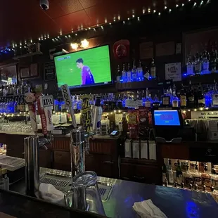 On tap and bottles. Footie on the TV.