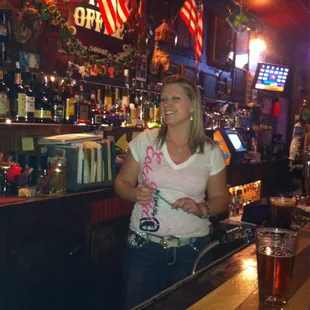 a woman standing at the bar