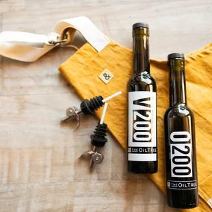 two bottles of wine on a table