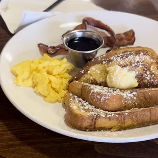 Classic French Toast w/ syrup on the side, scrambled eggs, and applewood bacon. Yum!