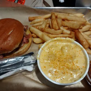 Pulled pork sandwich with fries and a side of Mac n cheese