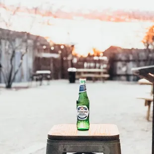 beer bottle on a stool