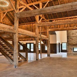 The dance floor and main gathering space is situated inside an 1850 barn with beautiful hand hewn beams and our stamped concrete dance floor