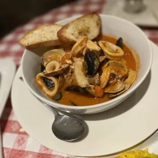 a bowl of soup with bread