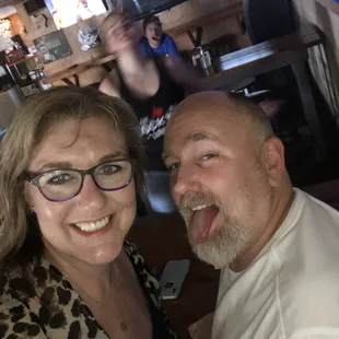 a man and a woman posing for a picture