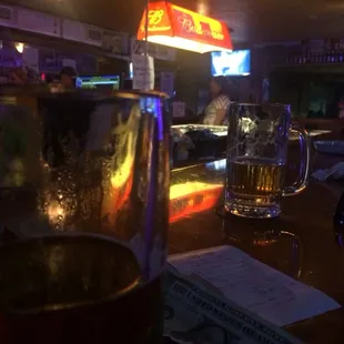 a glass of beer on the bar
