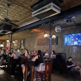 a group of people sitting at a bar