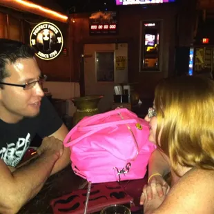 a man and a woman at a bar