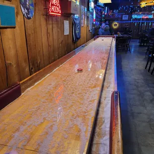 a shuffle table in a bar