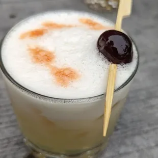 a drink in a glass on a table