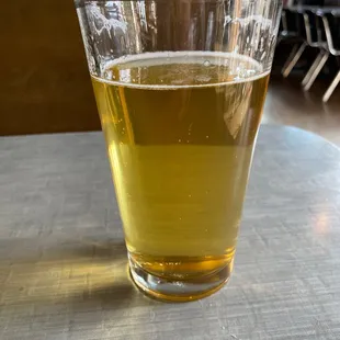 a glass of beer on a table