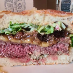 ELK BURGER° 16
 Durham Ranch Elk, Smoked Gouda, Bacon &amp; Date Jam, Roasted Garlic &amp; Herb Mayo, Mixed Greens, served on a Grand Central Bakery