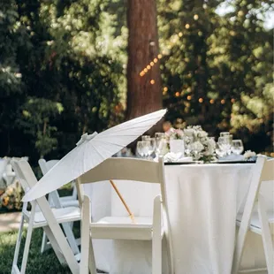 Table setting with parasol. Table and chairs provided by The Old Homestead.