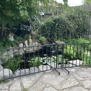 a garden with a small pond