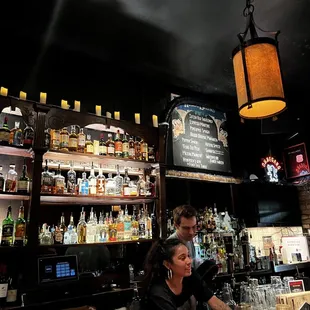 a woman sitting at a bar