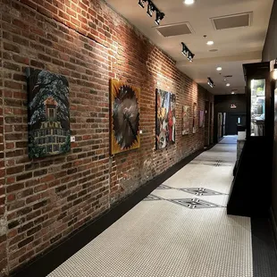 Hallway towards second set of elevators with cool local art