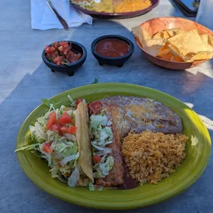 Lunch combo chicken taco and cheese enchilada