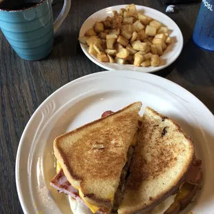 a plate of food and a cup of coffee