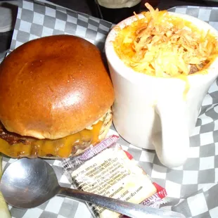 Heine&apos;s Tavern Burger on a Pretzel Bun with a side of Mac &amp; Cheese Soup.