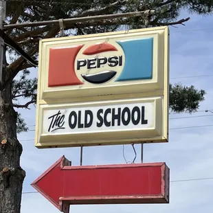 a pepsi sign and arrow