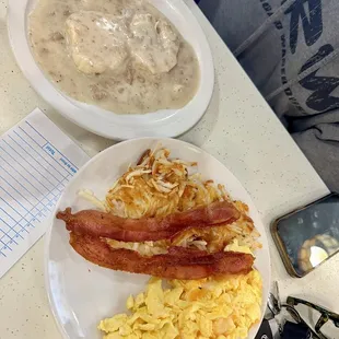 Biscuit and gravy special with scrambled eggs, bacon, and crispy hashbrowns