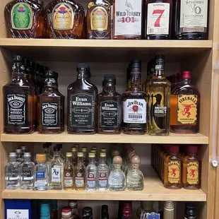 a shelf full of liquor bottles