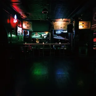 a bar with neon signs
