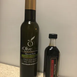 a bottle of extra virgin olive oil next to a bottle of extra virgin olive oil