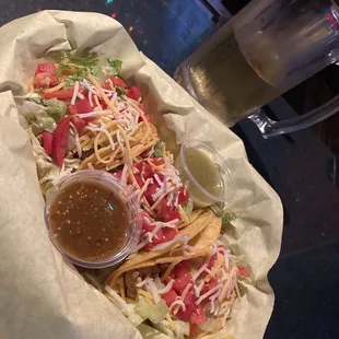 a plate of food and a glass of beer