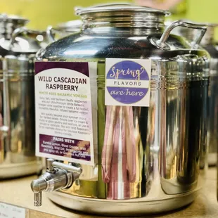 a variety of silver containers with labels on them