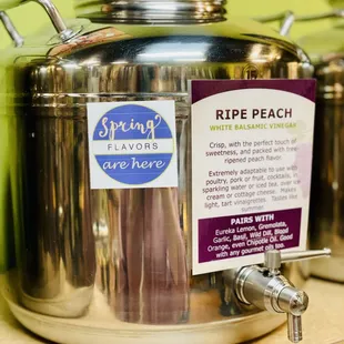 a row of stainless steel containers with labels on them