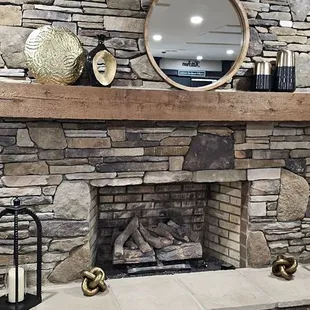 A large fireplace in the dining area