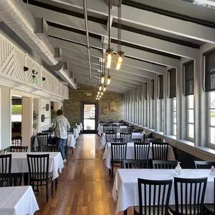 an empty restaurant with tables and chairs